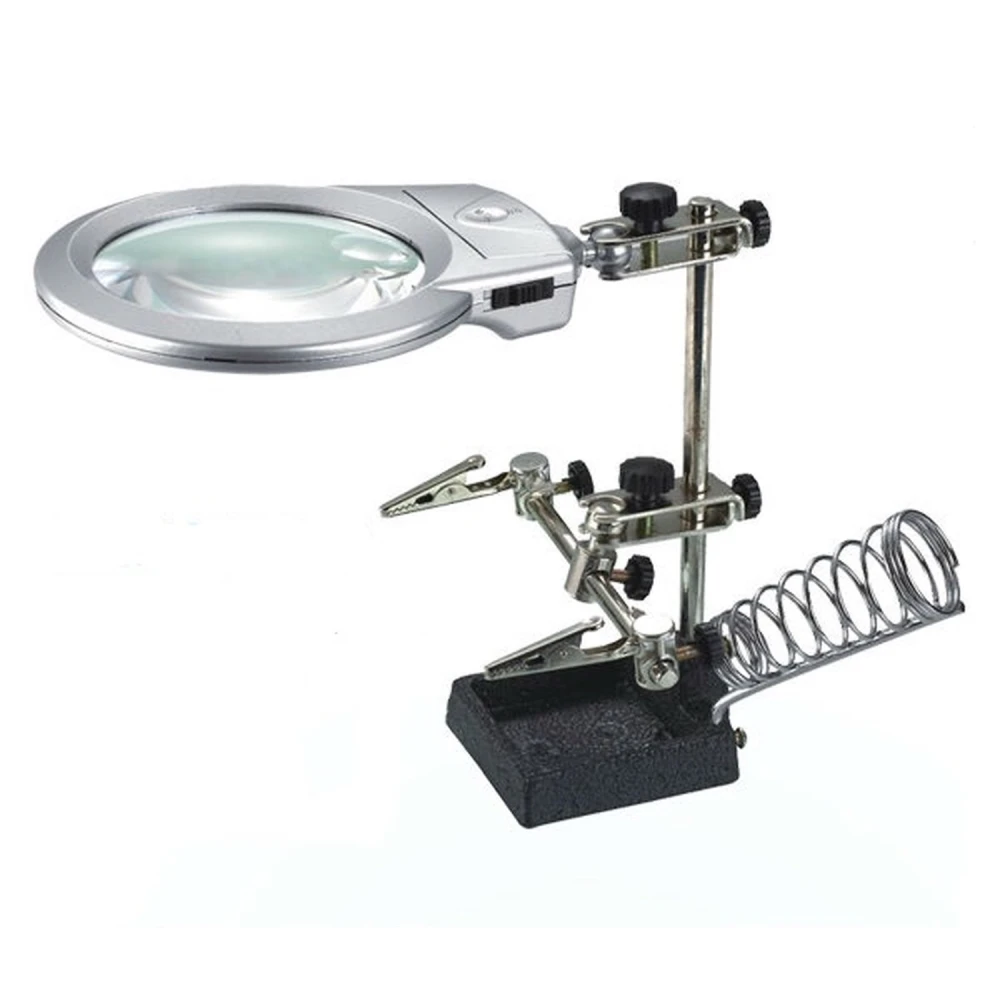 Detalle de la lupa con luz LED integrada en soporte para soldador